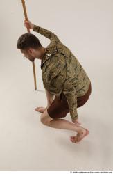 KEETA KNEELING POSE WITH SPEAR